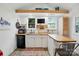 Efficient kitchen featuring butcher block countertops and modern appliances in a compact living space at 4235 Howie Cir, Charlotte, NC 28205