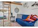 Cozy living area with a comfortable blue couch and ladder access to the loft space at 4235 Howie Cir, Charlotte, NC 28205