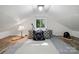 Cozy loft area with a comfortable bed and ample natural light for a relaxing retreat at 4235 Howie Cir, Charlotte, NC 28205