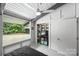 Bedroom with closet and large window offering backyard views, letting in natural light at 447 Merwick Cir, Charlotte, NC 28211