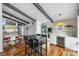 Dining area featuring modern table, wine fridge, and access to an outdoor patio at 447 Merwick Cir, Charlotte, NC 28211