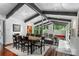 Open dining room features ample seating with views into the living room and a fireplace at 447 Merwick Cir, Charlotte, NC 28211
