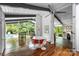 Bright dining area with modern lighting, a fan and views of the pool, perfect for gatherings at 447 Merwick Cir, Charlotte, NC 28211