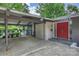 Home's entrance with a carport and vibrant red double doors at 447 Merwick Cir, Charlotte, NC 28211