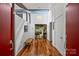Entry foyer with wood floors, skylights, and modern lighting at 447 Merwick Cir, Charlotte, NC 28211