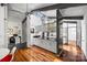 Bright kitchen featuring a skylight, modern cabinetry, black countertops, and hardwood floors at 447 Merwick Cir, Charlotte, NC 28211