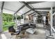 Bright living room with floor to ceiling windows and open floor plan, perfect for entertaining at 447 Merwick Cir, Charlotte, NC 28211