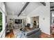Bright living space with shelving, desk, and hardwood floors open to adjacent room at 447 Merwick Cir, Charlotte, NC 28211