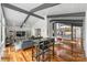 Open floor plan with hardwood floors connecting the living room, dining area, and kitchen at 447 Merwick Cir, Charlotte, NC 28211
