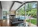 Open-concept living space with a view of the pool area and modern furnishings at 447 Merwick Cir, Charlotte, NC 28211