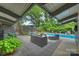 Inviting backyard oasis featuring a sparkling pool and patio area perfect for outdoor relaxation and entertainment at 447 Merwick Cir, Charlotte, NC 28211