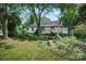 A large backyard with mature trees offers lots of potential for outdoor activities and landscaping at 514 S Martin St, Shelby, NC 28150