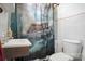 This bathroom has a vanity and toilet with a ship shower curtain at 514 S Martin St, Shelby, NC 28150