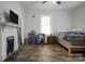 This bedroom has space for a bed and dresser, and also a fireplace at 514 S Martin St, Shelby, NC 28150