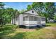 Quaint home with a screened-in porch, nestled among mature trees, in need of some tender loving care at 514 S Martin St, Shelby, NC 28150