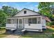 Charming home featuring a screened porch, offering a cozy and inviting outdoor living space at 514 S Martin St, Shelby, NC 28150