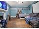 This cozy living room has built in shelving, wood floors, and a fireplace at 514 S Martin St, Shelby, NC 28150