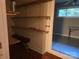 This storage space includes shelves and a window to the next room at 520 Crestview Dr, Albemarle, NC 28001