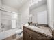 Clean bathroom featuring a shower-tub combination and granite vanity at 5366 Meadowcroft Way, Fort Mill, SC 29708