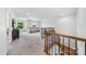 Bright bonus room with plush carpeting, large windows, and comfortable seating arrangement at 5366 Meadowcroft Way, Fort Mill, SC 29708