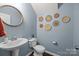 Stylish powder room showcasing modern fixtures, decorative wall art, and a clean, minimalist design at 6119 Castlecove Rd, Charlotte, NC 28278