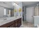 Stylish bathroom with double sink vanity, decorative art, and a separate shower provides comfort and elegance at 6119 Castlecove Rd, Charlotte, NC 28278