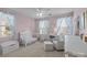 Charming Bedroom with soft pink walls, a white crib, and patterned curtains creates a cozy and inviting space at 6119 Castlecove Rd, Charlotte, NC 28278