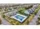 Aerial view of the community pool with a seating area and manicured landscaping at 6119 Castlecove Rd, Charlotte, NC 28278
