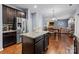 Spacious kitchen with stainless steel appliances, granite countertops and adjacent dining area perfect for hosting gatherings at 6119 Castlecove Rd, Charlotte, NC 28278