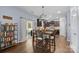 Open-concept kitchen area with hardwood floors and modern lighting at 6119 Castlecove Rd, Charlotte, NC 28278
