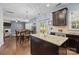 Open concept kitchen with granite island flows into dining and living areas, great for entertaining and Gathering time at 6119 Castlecove Rd, Charlotte, NC 28278