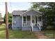 Charming single story home with a front porch and well-maintained exterior, perfect for starter home at 614 Goldsboro Ave, Statesville, NC 28677