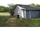 View of the side exterior of the home, showing the siding and window placements at 614 Goldsboro Ave, Statesville, NC 28677