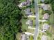 Another aerial perspective showing lush landscaping, mature trees, and the neighborhood layout from above at 6309 Crosshall Pl, Waxhaw, NC 28173