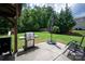 Enjoy the backyard patio featuring a grill, seating, and a lush lawn, ideal for outdoor entertaining at 6309 Crosshall Pl, Waxhaw, NC 28173