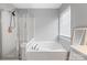 Bright bathroom with tub, shower, and a large vanity at 6309 Crosshall Pl, Waxhaw, NC 28173