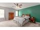 Bedroom featuring a wood armoire, bedside table, and natural light at 6309 Crosshall Pl, Waxhaw, NC 28173