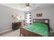 bedroom with a wooden bed, playful decor, and natural light at 6309 Crosshall Pl, Waxhaw, NC 28173