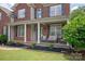 Charming front porch with cozy seating, creating a welcoming entrance to this beautiful home at 6309 Crosshall Pl, Waxhaw, NC 28173