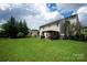 A well-maintained backyard offers an outdoor living space and manicured lawn at 6309 Crosshall Pl, Waxhaw, NC 28173