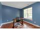 Office space with ample light and an ergonomic desk and chair at 6309 Crosshall Pl, Waxhaw, NC 28173