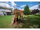 Fun backyard playset with climbing wall, slide, and swings ready for your Gathering to enjoy! at 6309 Crosshall Pl, Waxhaw, NC 28173