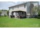 Outdoor patio with grill and dining table, ideal for entertaining in a private backyard at 6309 Crosshall Pl, Waxhaw, NC 28173