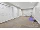 Finished basement featuring carpeted floors, exercise equipment, and ample space, ideal for recreation at 6647 Gaywind Dr, Charlotte, NC 28226