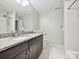 Neutral bathroom featuring a granite countertop, under-mount sink, and framed mirror at 6647 Gaywind Dr, Charlotte, NC 28226