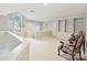 Spacious bonus room with built-in bookshelves and lots of natural light at 6647 Gaywind Dr, Charlotte, NC 28226