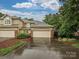 Beautiful home exterior featuring a three-car garage, manicured lawn, and a well-maintained driveway at 6647 Gaywind Dr, Charlotte, NC 28226