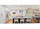 Modern kitchen featuring white cabinets, stainless steel appliances, and a large island with seating at 6647 Gaywind Dr, Charlotte, NC 28226