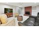 Inviting living room with a fireplace and comfortable seating area at 6647 Gaywind Dr, Charlotte, NC 28226