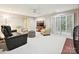 Cozy living room with plush seating, ceiling fan and a neutral color palette at 6647 Gaywind Dr, Charlotte, NC 28226